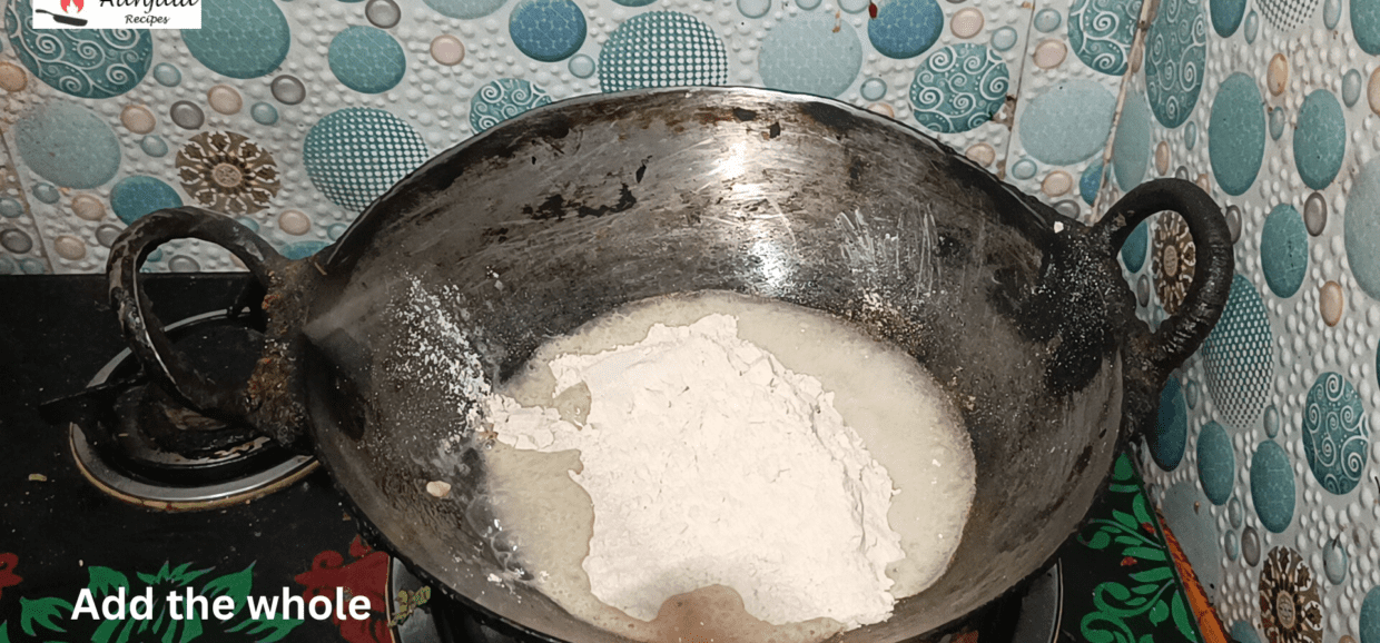Add the whole wheat flour (atta)